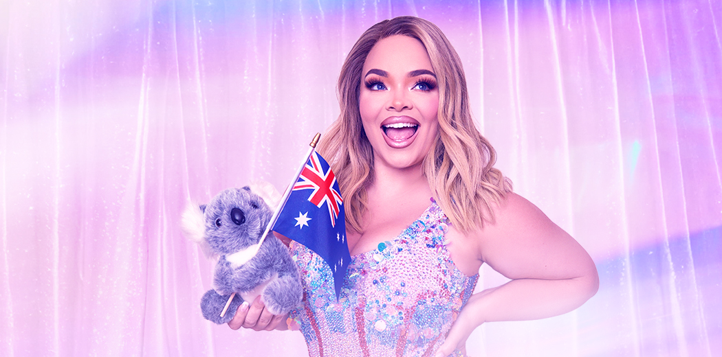 Smiling woman in a sparkling dress holds a koala plush toy and Australian flag against a pink curtain.