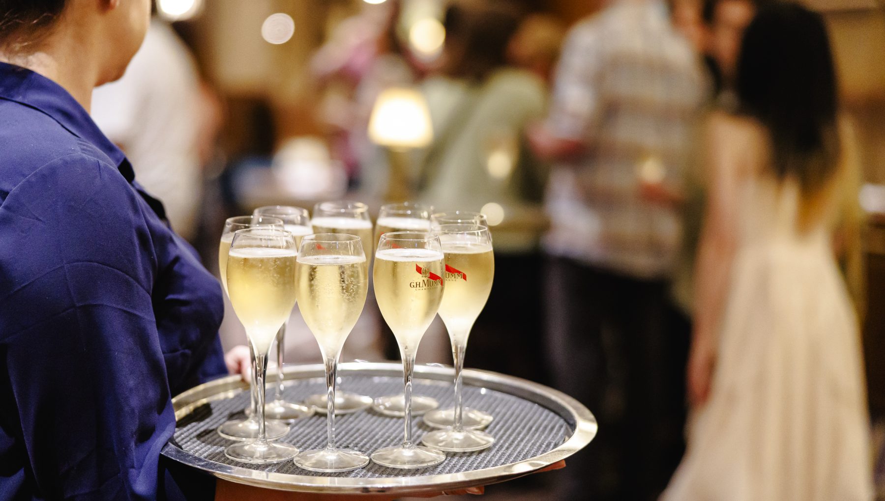 Glasses of sparkling wine being served at an event at Rydges South Bank Brisbane.